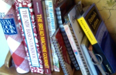 Penina's Letters in a row of cookbooks at Em's